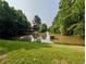 Scenic pond surrounded by lush trees, complemented by a serene water fountain feature at 2804 Stillwater Park Dr, Marietta, GA 30066