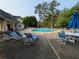 Inviting community pool area surrounded by lounge chairs and tables for relaxation at 2804 Stillwater Park Dr, Marietta, GA 30066