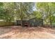 Home with a spacious, tree-lined backyard at 3404 Broxton Mill Way, Snellville, GA 30039
