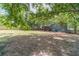 Expansive backyard with mature trees and lush lawn at 3404 Broxton Mill Way, Snellville, GA 30039
