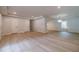 Spacious basement area with hardwood floors and recessed lighting at 3404 Broxton Mill Way, Snellville, GA 30039