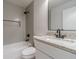 Modern bathroom with tiled shower, granite countertop, and white vanity at 3404 Broxton Mill Way, Snellville, GA 30039