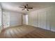 Bedroom features a ceiling fan, carpeted floors and a closet with bi-fold doors at 3404 Broxton Mill Way, Snellville, GA 30039
