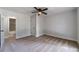 Carpeted bedroom with a ceiling fan, large window and closet at 3404 Broxton Mill Way, Snellville, GA 30039