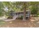 Charming home featuring a welcoming front porch, lush landscaping, and inviting curb appeal at 3404 Broxton Mill Way, Snellville, GA 30039