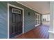 Welcoming front porch with a dark wood door and matching accents at 3404 Broxton Mill Way, Snellville, GA 30039