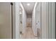 Long hallway with doorways leading to bedrooms and bathrooms in a well-lit home at 3404 Broxton Mill Way, Snellville, GA 30039