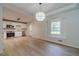 Modern kitchen with white cabinets, stainless steel appliances, and hardwood floors at 3404 Broxton Mill Way, Snellville, GA 30039