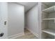 View of the laundry room with shelving and washer/dryer hookups, and wood style floors at 3404 Broxton Mill Way, Snellville, GA 30039