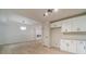 Bright living room area with wood flooring next to the modern kitchen area at 3404 Broxton Mill Way, Snellville, GA 30039