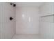 Updated shower features vertical tiling, matte black fixtures and a built-in niche at 3404 Broxton Mill Way, Snellville, GA 30039