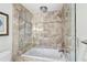 Elegant bathroom features a glass-enclosed shower and separate tub at 70 Old Ivy Ne Rd # 57, Atlanta, GA 30342