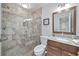 Bathroom featuring granite vanity, walk-in shower, and linen storage at 70 Old Ivy Ne Rd # 57, Atlanta, GA 30342