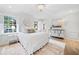 Cozy bedroom with hardwood floors, natural light, and comfortable furnishings at 70 Old Ivy Ne Rd # 57, Atlanta, GA 30342