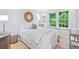 Inviting bedroom with hardwood floors and bright windows with shutters at 70 Old Ivy Ne Rd # 57, Atlanta, GA 30342