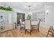 Cozy dining area with a round table, stylish chairs, and elegant lighting fixture at 70 Old Ivy Ne Rd # 57, Atlanta, GA 30342