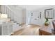 Bright entryway with hardwood floors, white trim, staircase, and ample natural light at 70 Old Ivy Ne Rd # 57, Atlanta, GA 30342