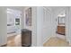 Hallway view showcasing hardwood floors leading to the bedroom and bathroom at 70 Old Ivy Ne Rd # 57, Atlanta, GA 30342