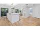 Open kitchen with an island, marble countertops, pendant lighting, and stainless appliances at 70 Old Ivy Ne Rd # 57, Atlanta, GA 30342