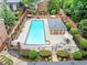 Community swimming pool with lounge chairs and a bath house surrounded by well-maintained landscaping at 70 Old Ivy Ne Rd # 57, Atlanta, GA 30342