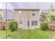 Green backyard with an adorable patio area and surrounded by a wooden fence at 257 Turnstone Rd, Stockbridge, GA 30281