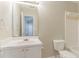 Bright bathroom displaying white fixtures, a mirror, and a combination shower-tub at 257 Turnstone Rd, Stockbridge, GA 30281