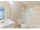 Cozy bathroom featuring white fixtures, tile accents, and a shower-tub combination at 257 Turnstone Rd, Stockbridge, GA 30281