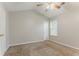Neutral bedroom offering plush carpeting, airy windows, and a ceiling fan for optimal comfort at 257 Turnstone Rd, Stockbridge, GA 30281