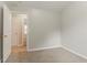 An inviting bedroom features neutral tones and an open doorway to adjoining spaces at 257 Turnstone Rd, Stockbridge, GA 30281