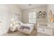 Comfortable bedroom with neutral walls and carpet, offering a serene retreat at 257 Turnstone Rd, Stockbridge, GA 30281
