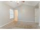 Bedroom with vaulted ceiling and carpeting; an open doorway leads to another room at 257 Turnstone Rd, Stockbridge, GA 30281