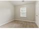 Bedroom featuring neutral paint, one window, carpet, and a closet at 257 Turnstone Rd, Stockbridge, GA 30281