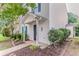 Close-up of charming home entrance with covered porch and landscaped front yard at 257 Turnstone Rd, Stockbridge, GA 30281