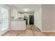 Bright kitchen featuring white cabinets and black appliances at 257 Turnstone Rd, Stockbridge, GA 30281