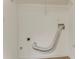 Functional laundry area with hookups, shelving, and clean, bright walls at 257 Turnstone Rd, Stockbridge, GA 30281