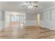 Open-concept living room with natural light, laminate floors, and neutral paint at 257 Turnstone Rd, Stockbridge, GA 30281