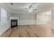 Spacious living room features a fireplace, laminate flooring, and neutral paint at 257 Turnstone Rd, Stockbridge, GA 30281
