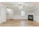 Spacious living room with a cozy fireplace and lots of light at 257 Turnstone Rd, Stockbridge, GA 30281