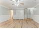 Bright living room featuring laminate flooring, a ceiling fan, and neutral paint at 257 Turnstone Rd, Stockbridge, GA 30281