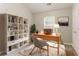 Bright office space featuring built-in shelving, desk, and ample natural light from the window at 257 Turnstone Rd, Stockbridge, GA 30281