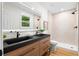 Spa-like bathroom featuring double vanity, modern fixtures, and glass-enclosed shower, providing a luxurious retreat at 2871 Tucker Mill Sw Rd, Conyers, GA 30094
