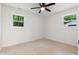 Spacious bedroom featuring neutral walls, ceiling fan and natural lighting at 2871 Tucker Mill Sw Rd, Conyers, GA 30094