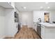 Well-equipped kitchen with white cabinets, stainless steel appliances, and a functional layout for meal preparation at 2871 Tucker Mill Sw Rd, Conyers, GA 30094