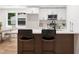 Modern kitchen featuring an island with bar seating, quartz countertops, and stainless steel appliances at 2871 Tucker Mill Sw Rd, Conyers, GA 30094