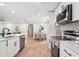 Gourmet kitchen featuring stainless appliances, white cabinetry, ample countertop space and modern fixtures at 2871 Tucker Mill Sw Rd, Conyers, GA 30094