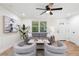 Comfortable living room with stylish furnishings, neutral palette, and modern lighting, creating an inviting atmosphere at 2871 Tucker Mill Sw Rd, Conyers, GA 30094
