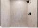 Modern shower featuring vertical white tile surround and matte black fixtures at 2871 Tucker Mill Sw Rd, Conyers, GA 30094