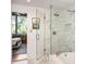 Modern bathroom featuring glass shower, soaking tub, and marble tile work at 3235 Roswell Ne Rd # 505, Atlanta, GA 30305