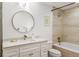 Bright bathroom with a marble-top vanity and a tub and shower combo at 3235 Roswell Ne Rd # 505, Atlanta, GA 30305