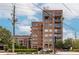 An exterior of a brick apartment building with arched windows and balconies at 3235 Roswell Ne Rd # 505, Atlanta, GA 30305